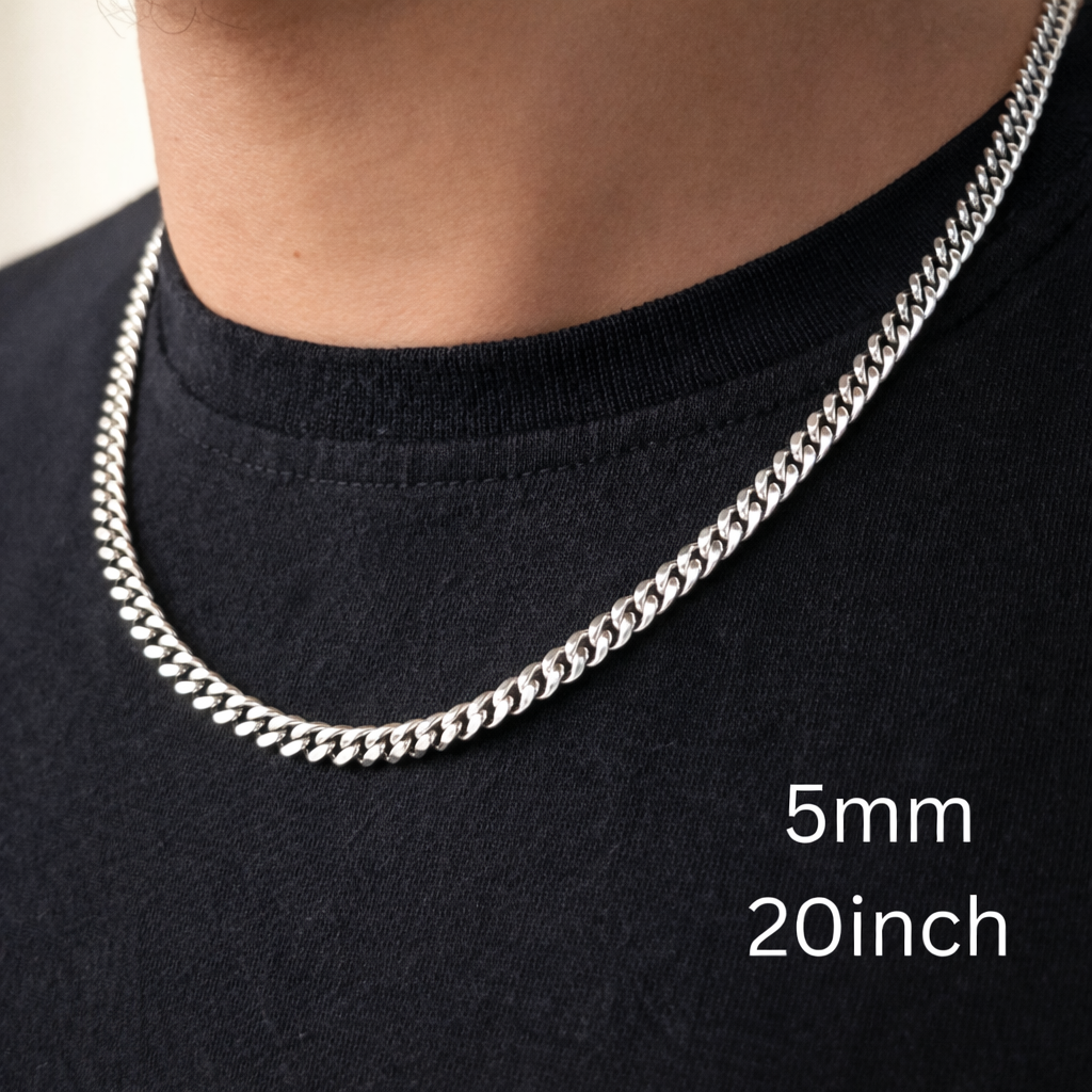 Silver chain necklace on a person wearing a black shirt, with size label '5mm 20inch'.