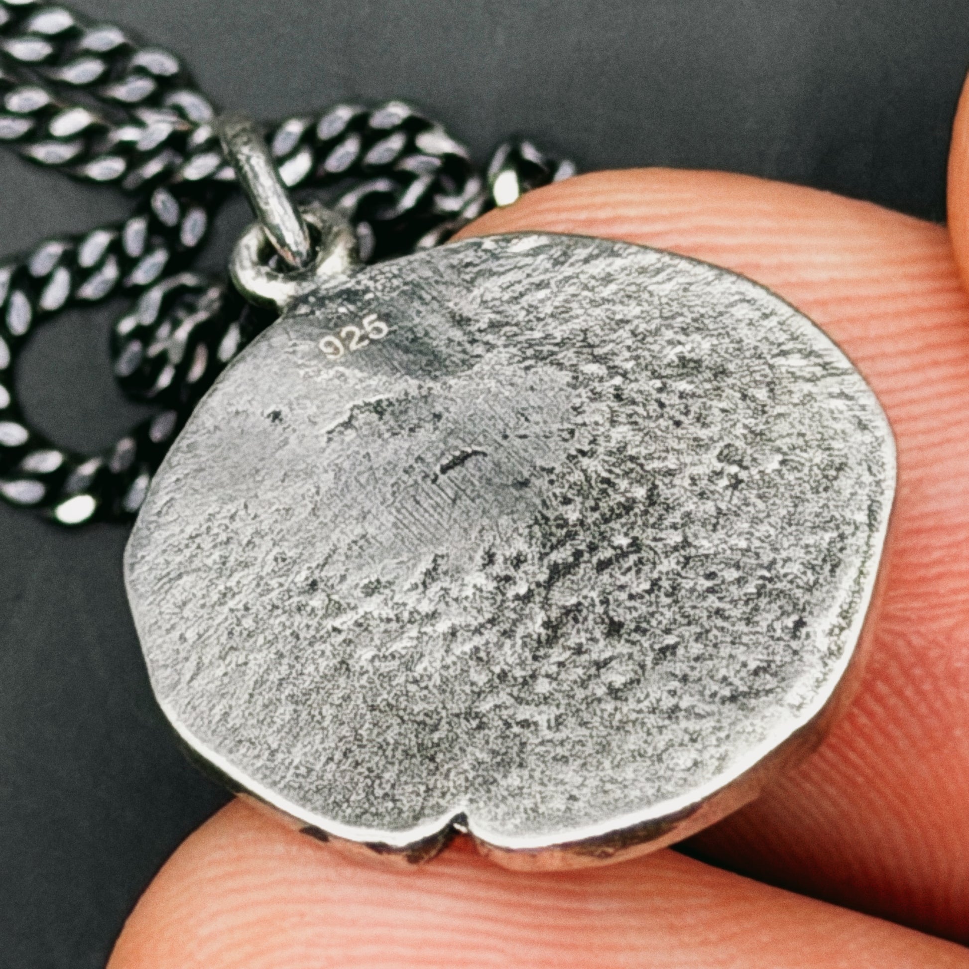 back view of piece on hand