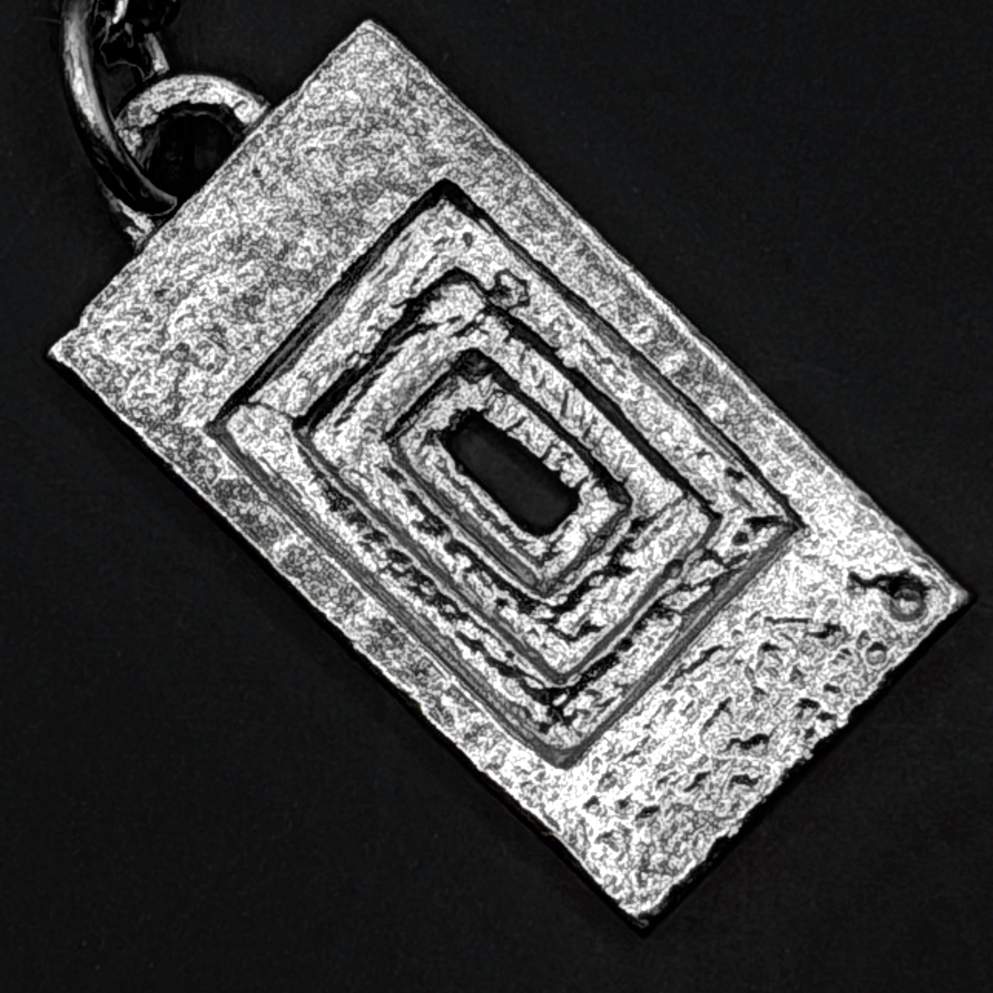 Close-up detail of silver pendant texture 