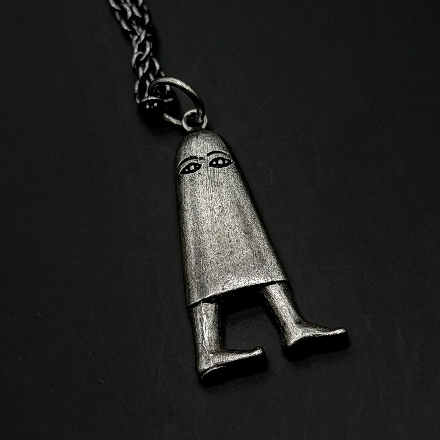 close up of silver pendant