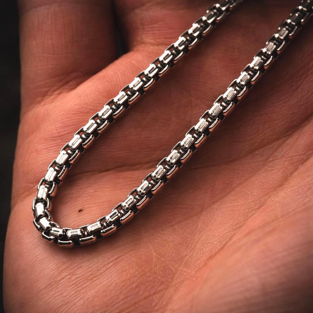 Silver chain on a hand
