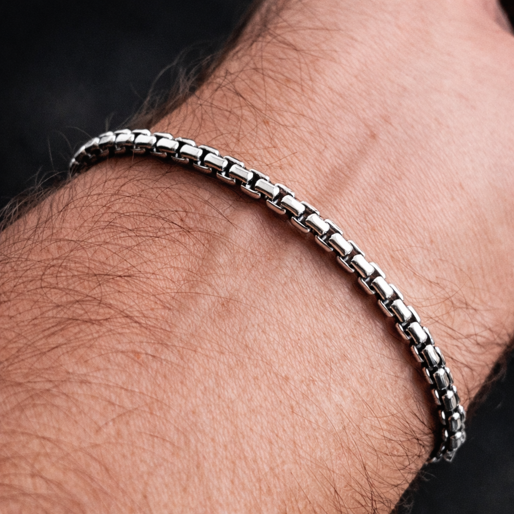 Silver bracelet on a wrist with a close-up view
