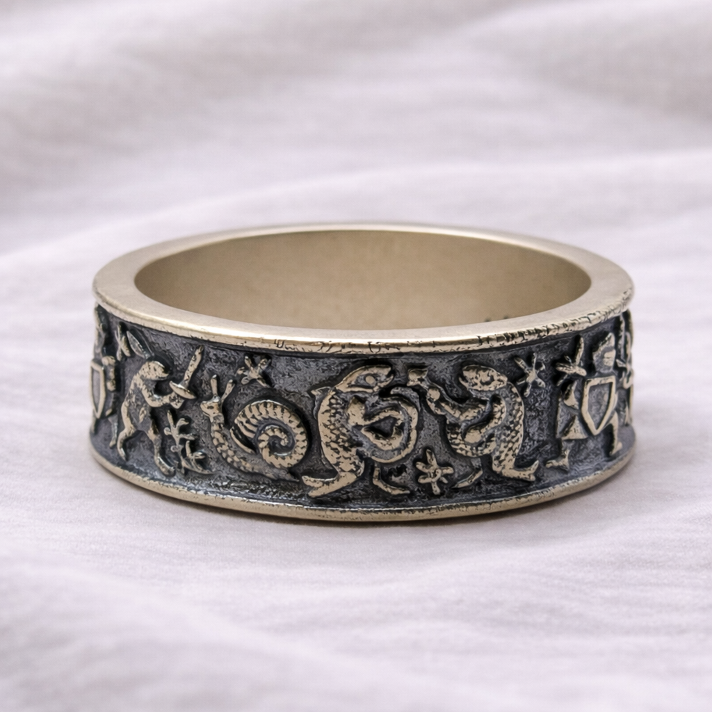 Decorative ceramic ring with embossed designs on a white background