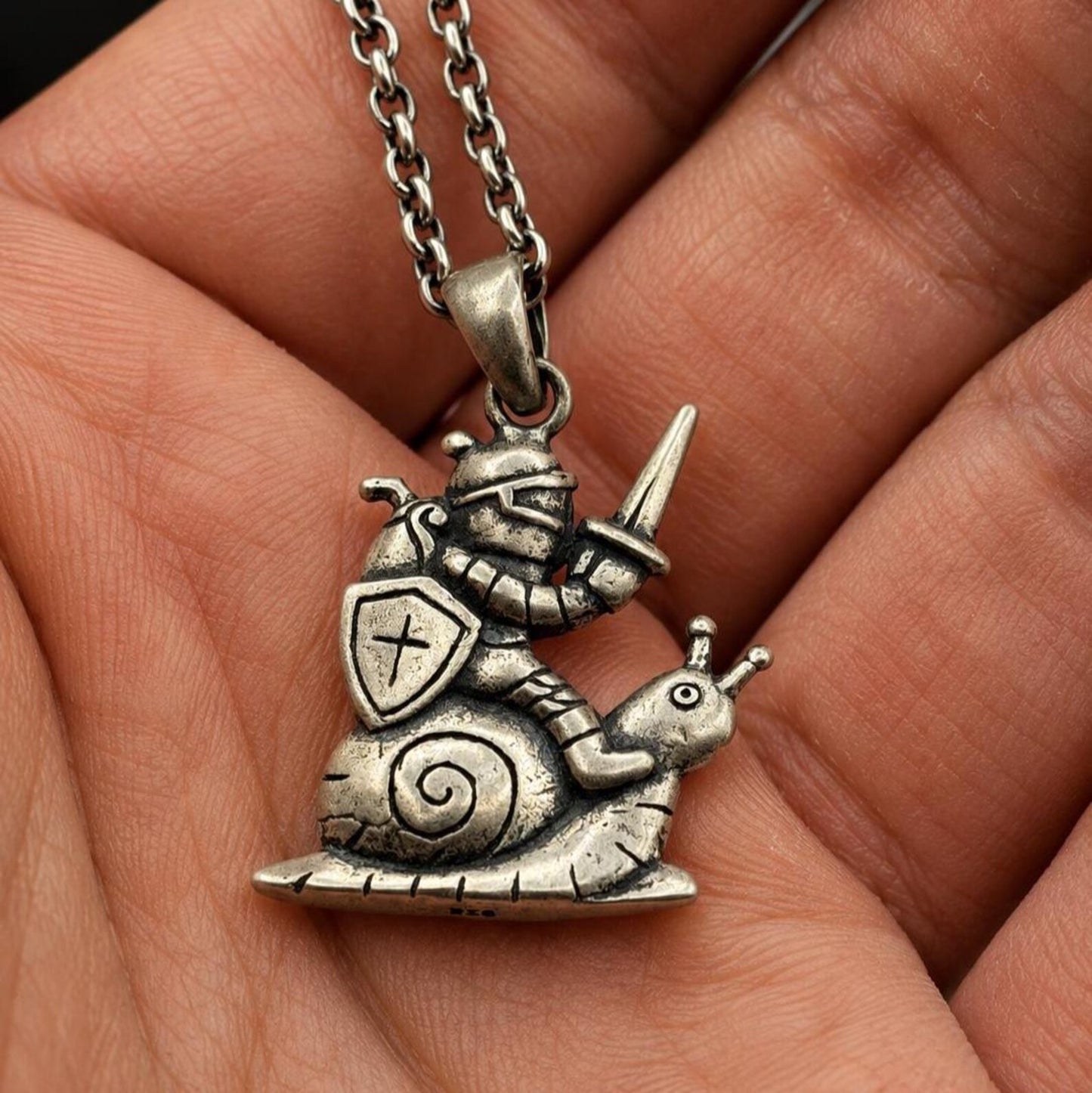 Medieval Knight Riding Snail Necklace